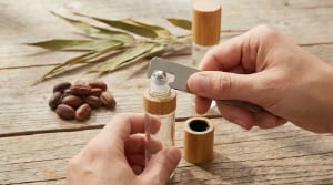 How do you get a stuck roller ball top off of an essential oil bottle?