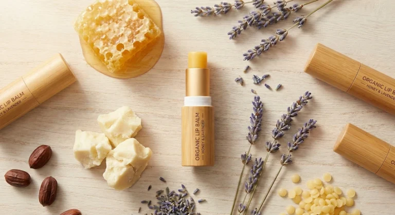 Premium bamboo lip balm tube displayed with natural organic ingredients.