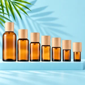 Seven amber glass essential oil bottles with light natural wood caps arranged on a cyan rectangular platform with a matching mint background and green palm leaves