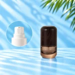 Compact smoke gray glass lotion bottle with rounded wood cap and a close-up inset of the white lotion pump.